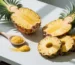 Pineapple and bromelain powder on a white table – natural bromelain enzyme blog cover photo